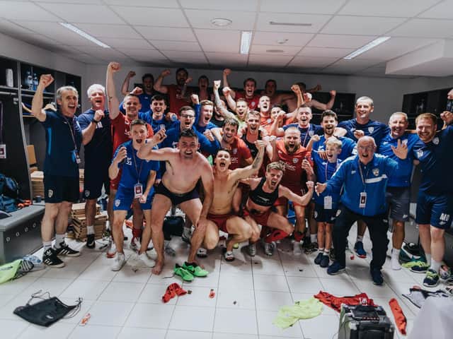 Coleraine players celebrate their historic win