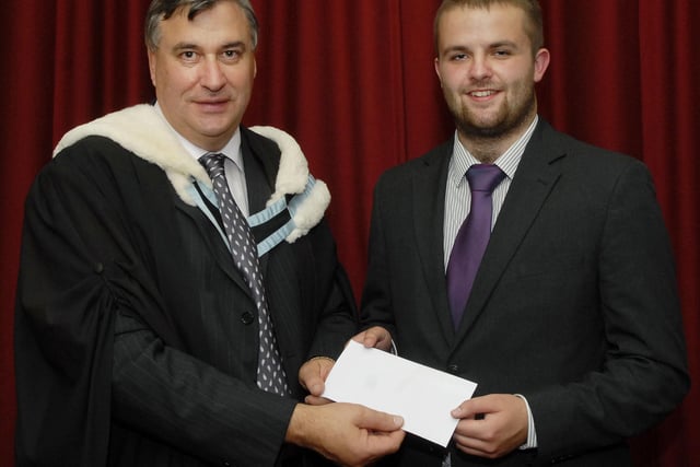 Mr. William Lynn, Head of Geology, presenting The Randalstown Geology Bursary to Peter Brown at the annual prize distribution held in The Guildhall by Foyle College. Peter will continue his studies at Imperial College, London. LS37-117KM10