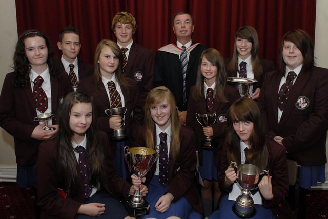 Mr. John McNee, Senior Vice Principal, pictured with Junior Prize Winners at the annual prize distribution held in The Guildhall by Foyle College, from left, seated, Rebecca Downey, Alexandra Graham and Jamie Baldrick, standing, Joanne Struthers, James Cole, Jade Gould, Patrick Leeson, Amy Young, Joanna Hawthorn and Bethan Heath. LS37-111KM10