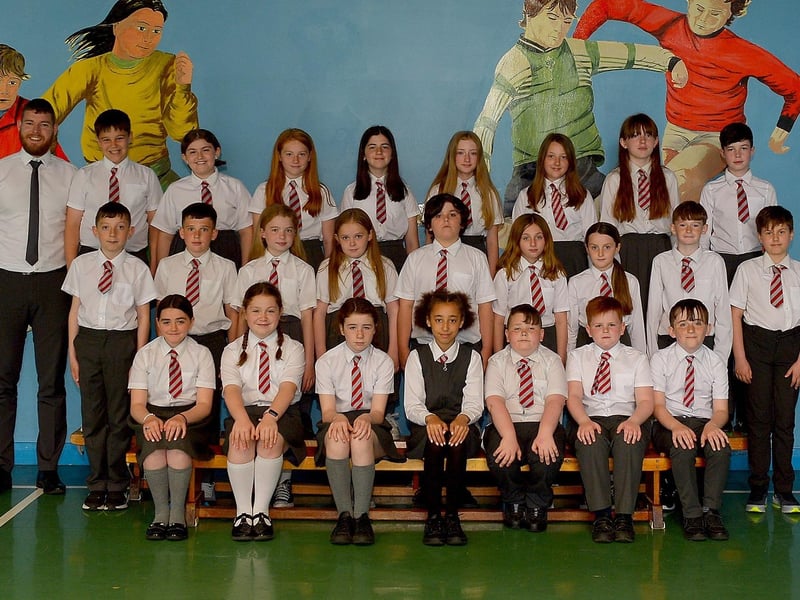 Mr F. Lagan with his P7 class at Holy Family Primary School, Derry. DER2123GS – 048