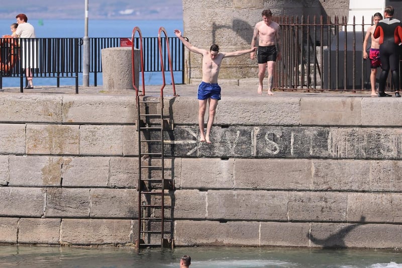 Only joking... As temperatures increase across Northern Ireland people enjoy the sun at Donaghadee in Co. Down.