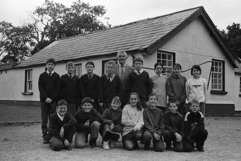 One of the last senior classes of St. Patrick’s National School, Drumfries, pictured outside their old schoolhouse which was opened in 1838.