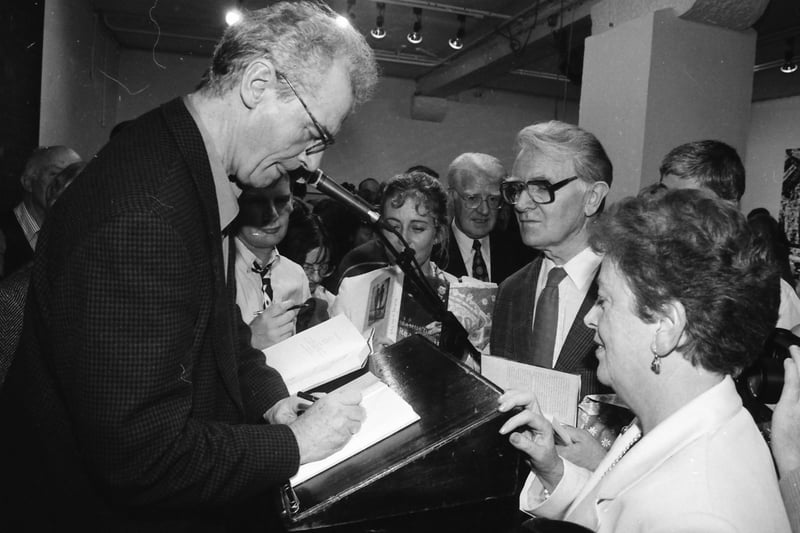 Seamus Deane signing copies of his book ‘Reading in the Dark’ at the launch in the Orchard Gallery.