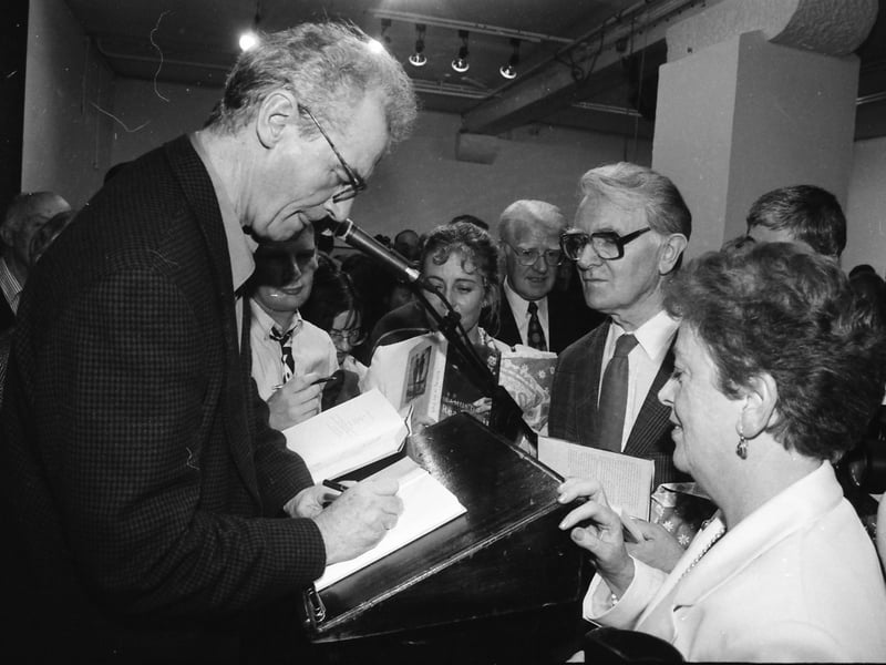 Seamus Deane signing copies of his book ‘Reading in the Dark’ at the launch in the Orchard Gallery.