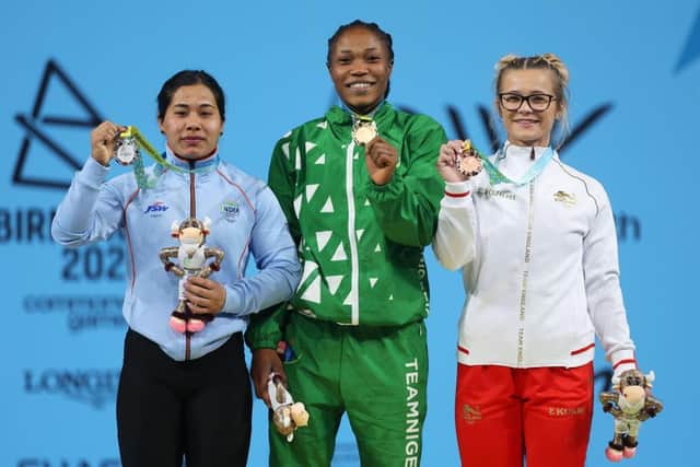 Doncaster's Fraer Morrow (right) celebrates her Commonwealth Games bronze medal in the Women's Weightlifting 55kg Final. Also pictured is silver medalist Bindyarani Devi Sorokhaibam (left) of Team India and gold medalist Adijat Adenike Olarinoye of Team Nigeria. Photo: Clive Brunskill/Getty Images