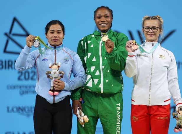 Doncaster's Fraer Morrow (right) celebrates her Commonwealth Games bronze medal in the Women's Weightlifting 55kg Final. Also pictured is silver medalist Bindyarani Devi Sorokhaibam (left) of Team India and gold medalist Adijat Adenike Olarinoye of Team Nigeria. Photo: Clive Brunskill/Getty Images