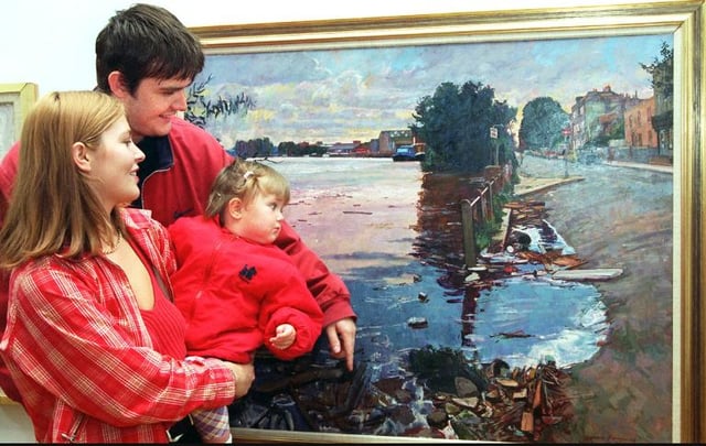 Danny Bubb and Sarah Grice of Adwick with their daughter Casey aged 16 months. Looking at an oil painting by William Bowyer in 1997.