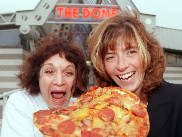 Staff at the the area's two sports Domes - The Doncaster Dome, and Barnsley's Metrodome - delivered a pizza to each other to raise money for Children in Need in 1998. Our picture shows Dome duty manager Shelley Armitgae (right) and the Metrodome's admin/finance officer tucking into one of the pizzas.