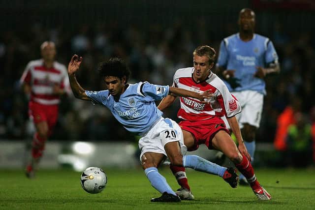 Man City's Yasser Hussein shields the ball from James Coppinger. Photo by Michael Steele/Getty Images