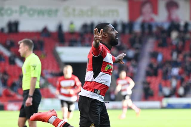 Hakeeb Adelakun celebrates scoring the only goal of the game against Wimbledon.