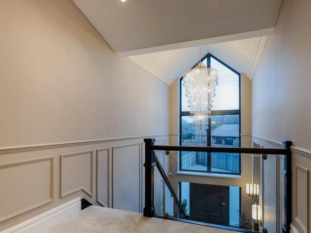 A view from the landing, with chandelier.