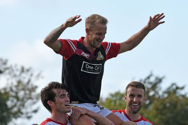 James Coppinger celebrates his 500th appearance for the club at Morecambe. Photo: Andrew Roe