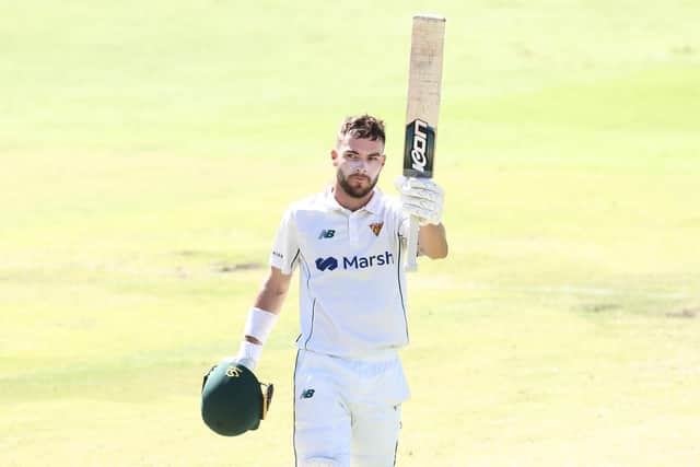 Caleb Jewell of Tasmania raises his bat after reaching his century during the Sheffield Shield match between Western Australia and South Australia at WACA, on March 04, 2023, in Perth, Australia. (Photo by Paul Kane/Getty Images)