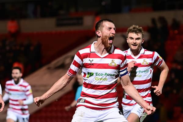 Doncaster Rovers Tom Anderson celebrates his goal.