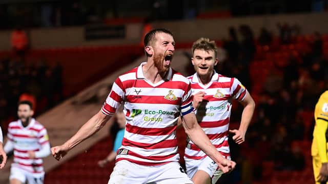 Doncaster Rovers Tom Anderson celebrates his goal.