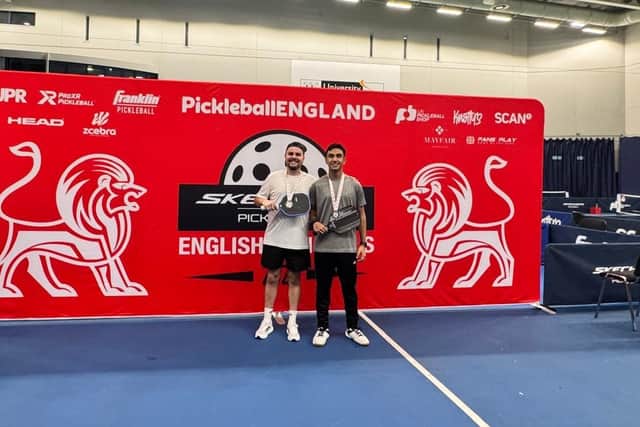 Stephen Hargreaves toasting pickleball medal success with his doubles partner Aaron Naik