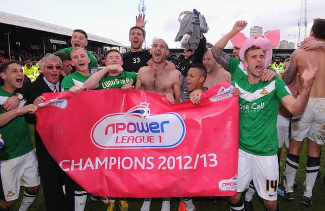 Rovers players celebrate promotion to the Championship