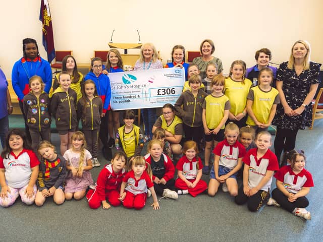 The Doncaster 55th Rainbows, Brownies and Guides are pictured with Lindsay Richards of the hospice.