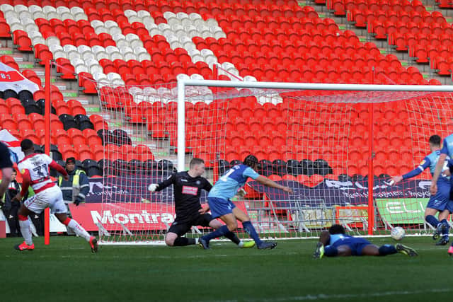 Niall Ennis slots in to put Doncaster Rovers ahead against Wycombe Wanderers. Picture: Marie Caley