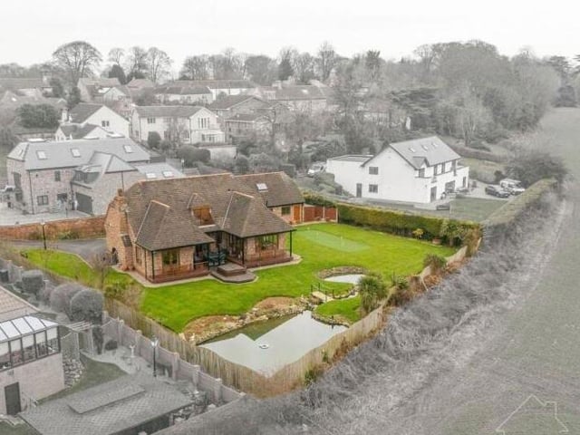 The impressive home and its scenic surroundings.