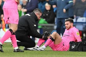 Doncaster's Jon Taylor receives treated from the physio.
