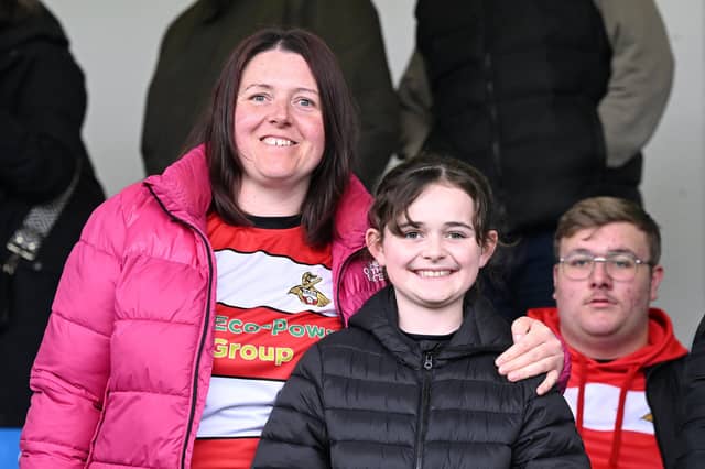 Doncaster Rovers were backed by a big away following at Gillingham as they officially sealed a play-off place.