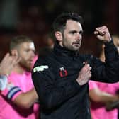 Danny Schofield enjoys a moment with the travelling fans at full-time.