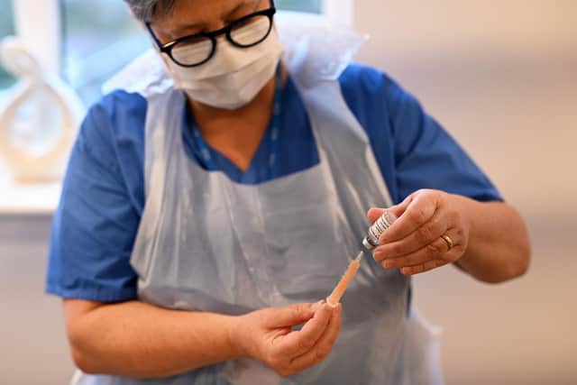 More people in the UK have now been vaccinated against Covid than have been infected by the virus since the pandemic began (Photo by OLI SCARFF/AFP via Getty Images)