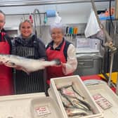 Charlotte and family: Going swimmingly. Charlotte is the latest in her family to take the plunge in the fish business. Pictured with her dad Mark and grandma Sheila who run G.A Jackson & Son set up by her late grandad Geoffrey Arthur Jackson