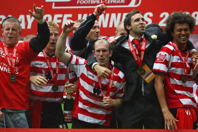 Roberts and his Doncaster Rovers teammates celebrate victory in the 2008 League One play-off final against Leeds United (photo by Clive Rose/Getty Images).