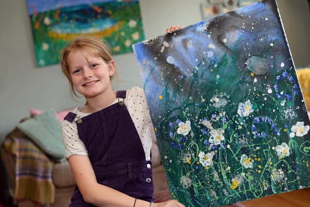 Artist Daisy Watt, 11, pictured with Midnight Petals. Picture: NDFP-22-09-20-Artist Watt 2-NMSY
