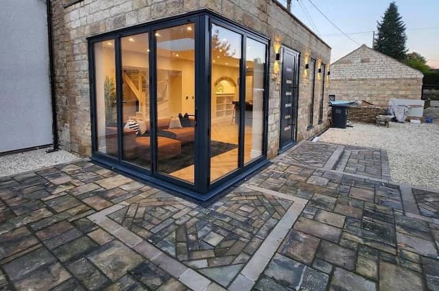 Original roof tiles from the property were re-purposed to form a unique patio area.