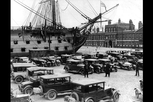 Luggage on the back of the cars with police standing guard. I wonder what was going on here around HMS Victory in Portsmouth Dockyard during the 1920s?