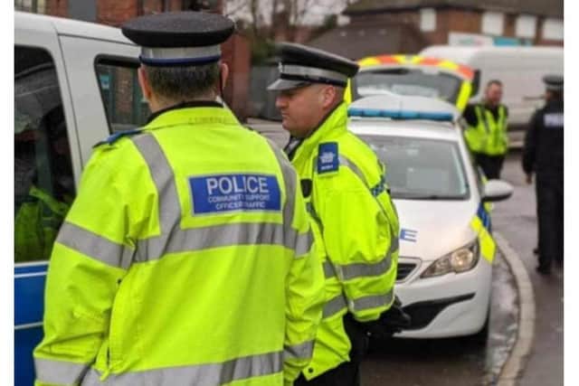 Police have been called in to disperse a mob which has gathered outside a shop at the centre of a rape investigation in Doncaster.