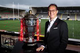 Jon Dutton poses with the men's World Cup trophy. Picture: SWPix.com