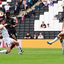 Mo Faal has a shot at goal for Doncaster Rovers.