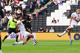 Mo Faal has a shot at goal for Doncaster Rovers.