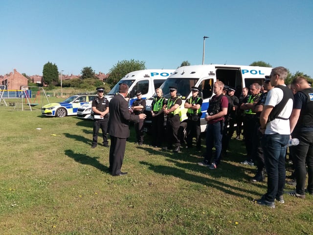Det Insp Steve Smith briefs police officers at the park on Schofield Street, Mexborough, ahead of a police operation against violent crime across three police districts in 2017