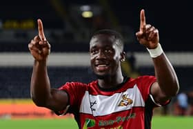 Fan favourite Joseph Olowu orchestrates the celebrations at full-time.