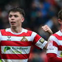 Patrick Kelly celebrates his goal in Rovers' 3-0 win over Colchester - a victory that moved them mightily close to promotion.