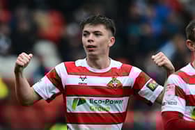 Patrick Kelly celebrates his goal in Rovers' 3-0 win over Colchester - a victory that moved them mightily close to promotion.