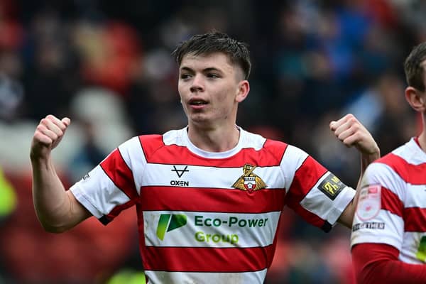 Patrick Kelly celebrates his goal in Rovers' 3-0 win over Colchester - a victory that moved them mightily close to promotion.