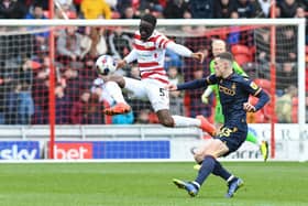 Joseph Olowu clears the ball to safety in Doncaster Rovers' defeat to Bradford City.