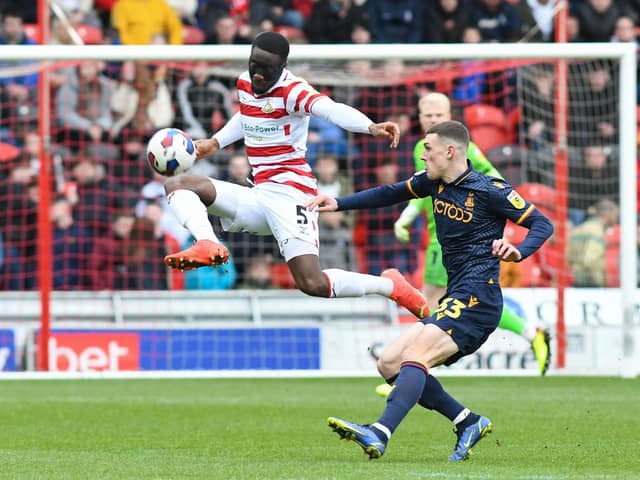 Joseph Olowu clears the ball to safety in Doncaster Rovers' defeat to Bradford City.