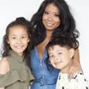 Junior pictured with his sister Ruby and mum Chrissie