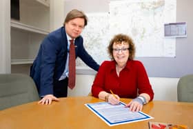 Pictured is, from the left, Toby Lewis, RDaSH Chief Executive, and Kathryn Lavery, RDaSH Chair, signing the Smokefree pledge