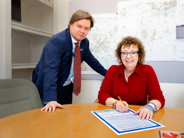 Pictured is, from the left, Toby Lewis, RDaSH Chief Executive, and Kathryn Lavery, RDaSH Chair, signing the Smokefree pledge