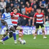 Kyle Hurst challenges for the ball against Grimsby.