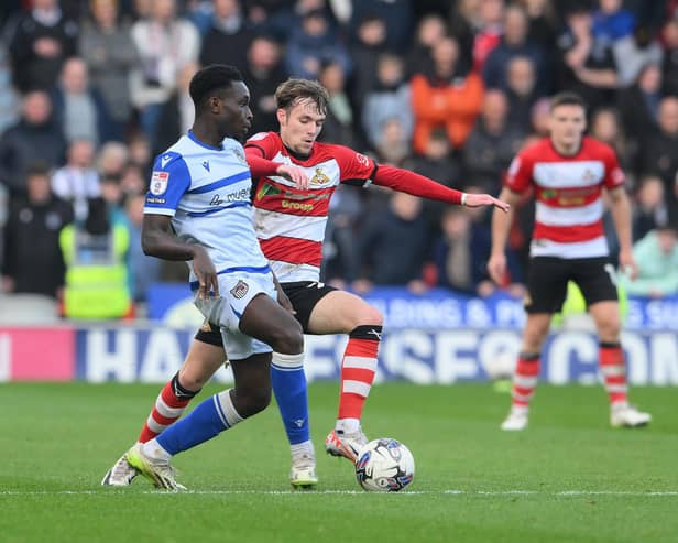 Kyle Hurst challenges for the ball against Grimsby.