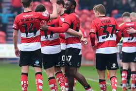 Doncaster's players celebrate Hakkeb Adelakun's goal. Picture:Andrew Roe/AHPIX LTD.